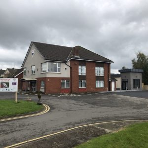 Side view of main building with family and community hub